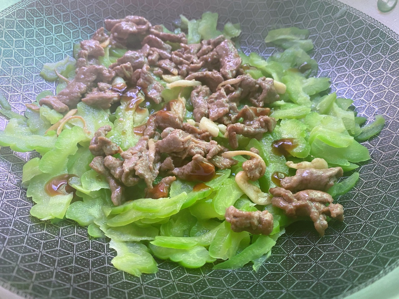 Beef with bitter melon in wok