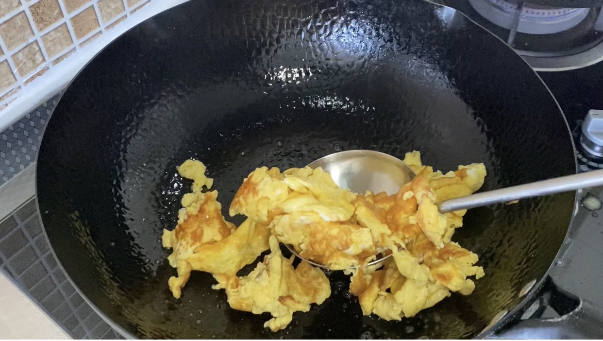 Scramble eggs until golden brown